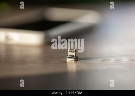 Magnetic cable for charging smartphone, close up. Stock Photo
