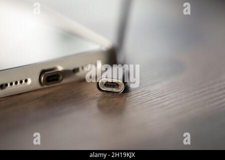 Magnetic cable for charging smartphone, close up. Stock Photo