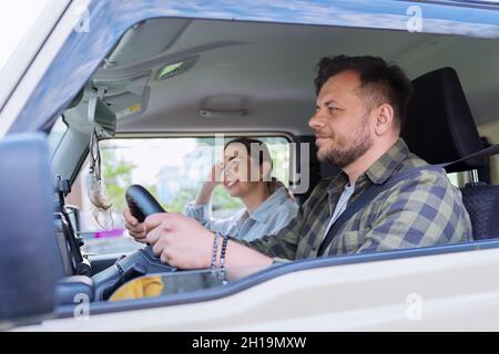Trip, middle-aged married couple riding in the car together. Stock Photo