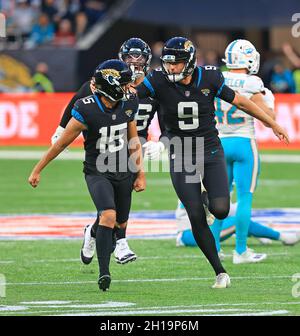 Jacksonville Jaguars place kicker Matthew Wright (15) and holder Logan  Cooke (9), right, celebrate their game-wining field goal after an NFL  football game against the Miami Dolphins at Tottenham Hotspur Stadium in