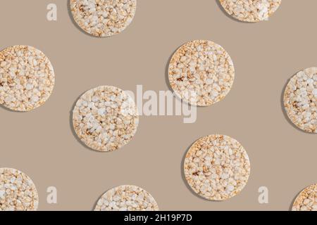 Creative pattern of rice cakes on bright background. Healthy lifestyle concept. Top view. Stock Photo