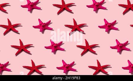 Creative pattern with starfish on blue background. Minimal summer concept. Stock Photo