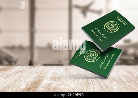 Pakistan passport floats in the air on wooden table, copy space, Islamic Republic of Pakistan Stock Photo