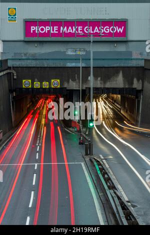 Glasgow, Scotland, UK. 17th Oct, 2021. PICTURED: People Make Glasgow sign above the South Entrance to the Clyde Tunnel looking north showing the A739 road with flowing traffic entering and exiting the tunnel. Countdown to COP26 Climate Change Conference/Summit which will officially commence 31 October ending on 12 November, a number of road closured around Glasgow will take effect from 24 October. Credit: Colin Fisher/Alamy Live News Stock Photo