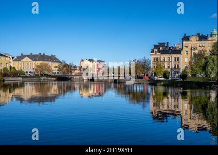 Norrkoping city and Motala river at Refvens grund on a sunny autumn day in October 2021. Norrkoping is a historic town in Sweden Stock Photo