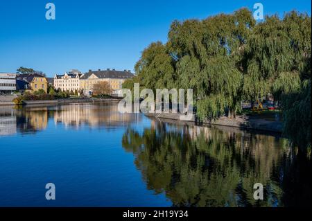 Norrkoping city and Motala river at Refvens grund on a sunny autumn day in October 2021. Norrkoping is a historic town in Sweden Stock Photo