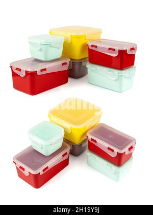 Multicolored plastic lunch boxes folded at corner isolated on white background, side view and top view Stock Photo