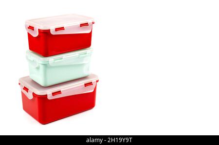 Plastic containers of different sizes for food products isolated on white background with copy space. Side view Stock Photo