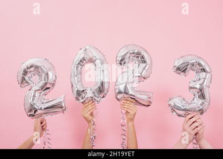 Festive balloons in from the numbers 2023 on a pink background. Stock Photo