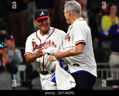 Atlanta Braves first base coach Eric Young Sr. (2) during a pitching change  in the sixth inning of a baseball game against the New York Mets, Saturday,  Oct. 1, 2022, in Atlanta. (
