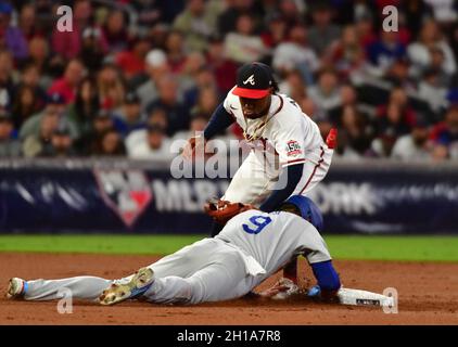 Atlanta, United States. 17th Oct, 2021. Los Angeles Dodgers Gavin Lux steals second under the tag of Atlanta Braves second baseman Ozzie Albies in the 1st inning in game two of the MLB NLCS at Truist Park in Atlanta, Georgia on Sunday, October 17, 2021. Photo by David Tulis/UPI Credit: UPI/Alamy Live News Stock Photo