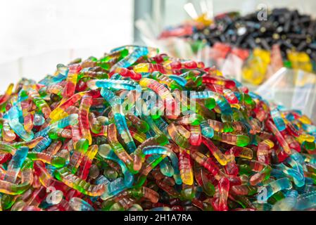 Juicy colorful jelly sweets, gummy candies, snakes. Stock Photo