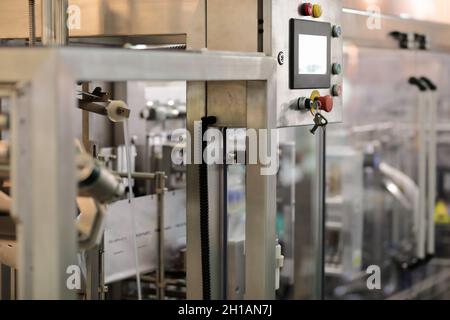 Automated food packaging equipment with focus on a control panel. Selective focus. Stock Photo