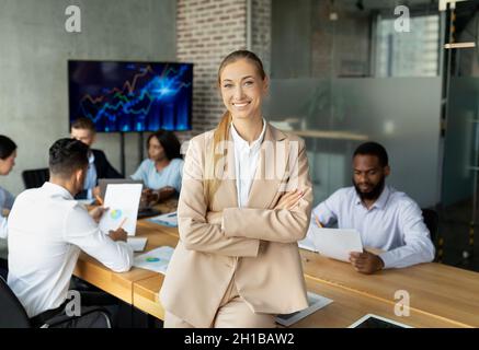 Business Management. Portrait Of Successful Young Female Entrepreneur Posing In Office Stock Photo