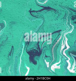 Acrylic texture made in liquid pour technique. Background in blue, turquoise and white colors. Stock Photo