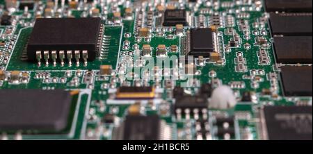 printed circuit board with surface mounted passive and active circuit components close up Stock Photo