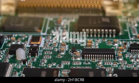 printed circuit board with surface mounted passive and active circuit components close up Stock Photo