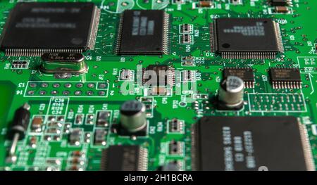 printed circuit board with surface mounted passive and active circuit components close up Stock Photo