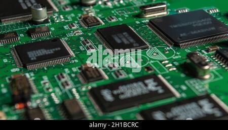 printed circuit board with surface mounted passive and active circuit components close up Stock Photo