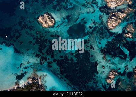 View from above, stunning aerial view of La Maddalena archipelago with some islands bathed by a turquoise and clear waters. Sardinia, Italy. Stock Photo