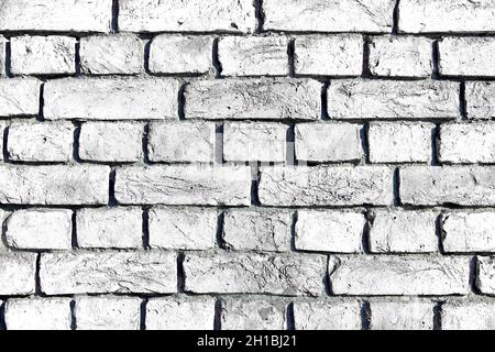 White brick wall. Simple white brick wall with light gray shades. Stock Photo