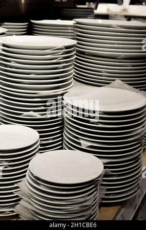 Stacked white plates for sale at IKEA, Sheffield, England Stock Photo