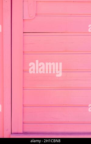 Weathered wooden plank painted in pink color Stock Photo