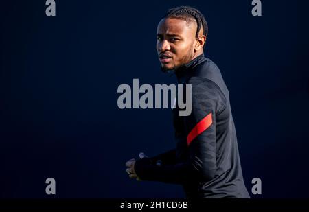 Leipzig, Germany. 18th Oct, 2021. Football: Champions League, group stage, final training before the group match Paris Saint-Germain - RB Leipzig at the Red Bull Academy. Leipzig's Christopher Nkunku arrives for training. Credit: Hendrik Schmidt/dpa-Zentralbild/dpa/Alamy Live News Stock Photo