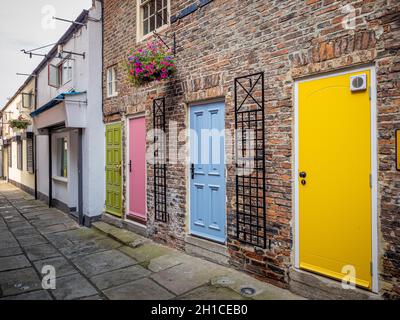 Brightly coloured doors seen in Buckton's Yard. Darlington Stock Photo