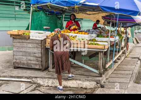 St John's, Antigua and Barbuda - December 18, 2018: Vendors fresh fruit and vegetable on a local market in St. John's, Antigua, West Indies, Caribbean Stock Photo