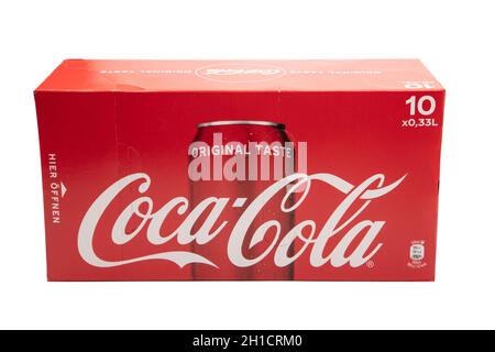 HUETTENBERG, GERMANY - FEBRUARY 03, 2020: Box with 10 COCA-COLA Cans isolated on white background.. Coca-Cola and the contour bottle design are tradem Stock Photo