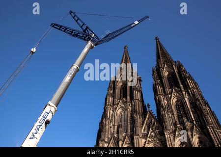 after the removing of a 30-meter-high scaffold, that hung for 10 years in 105 meters hight at the north tower of the cathedral, the 124 meter high cra Stock Photo