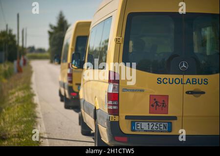 ROVIGO, ITALY 20 FEBRUARY 2020: Italian school bus travels on the road Stock Photo