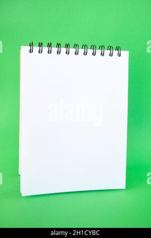 School supplies on bright green background with copyspace. Back to school concept. Stock Photo