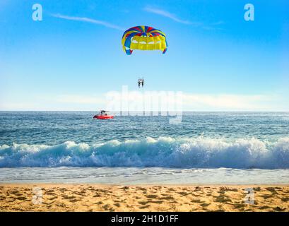 Parasailing over sea in sunny summer day Stock Photo