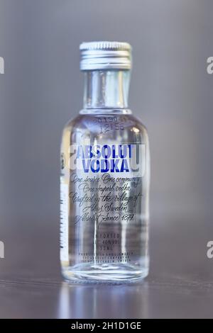 BUDAPEST, HUNGARY - CIRCA 2019: Absolut Vodka from Sweden on a table in a small bottle of 50 ml in window light Stock Photo