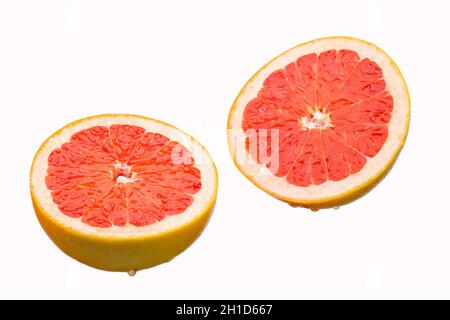 Fresh grapefruit slices, isolated on a white background Stock Photo