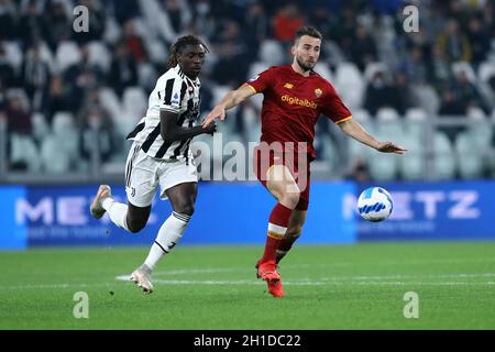 Bryan Cristante of As Roma and Moise Kean of Juventus Fc  battle for the ball during the Serie A match between Juventus Fc and As Roma Stock Photo