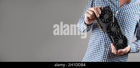 A man holding a video card  Stock Photo