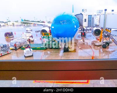 Miami, Florida, USA - December 12, 2019: The view of the Miami Airport in Miami, Florida, USA showcasing some of its docks with lots of planes loading Stock Photo