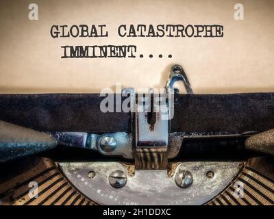 Global catastrophe imminent displayed on a Vintage Typewriter Stock Photo