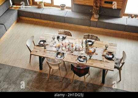 High angle view of served dining table decorated in autumn design in the biig dining room Stock Photo