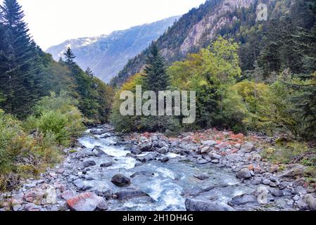 Cauterets, France - 10 Oct 2021: Waterfalls cascade from the Pyrenees mountains near La Raillere springs Stock Photo