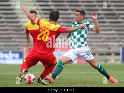LAVRADIO, PORTUGAL - OCTOBER 16: Goncalo Franco of Moreirense FC competes for the ball with Joao Pinto of Oriental Dragon FC ,during the Portuguese Cup match between Oriental Dragon FC and Moreirense FC at Estadio Alfredo Da Silva on October 16, 2021 in Lavradio, Portugal. (MB Media) Stock Photo