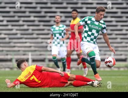 LAVRADIO, PORTUGAL - OCTOBER 16: Goncalo Franco of Moreirense FC competes for the ball with Bandeira of Oriental Dragon FC ,during the Portuguese Cup match between Oriental Dragon FC and Moreirense FC at Estadio Alfredo Da Silva on October 16, 2021 in Lavradio, Portugal. (MB Media) Stock Photo