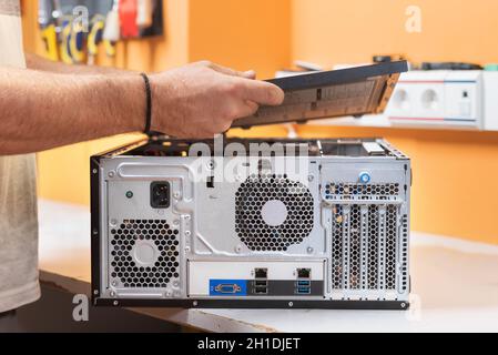 Technician repairing the computer. Concept of computer hardware, repairing, upgrade and technology . Stock Photo
