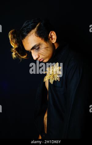 Closeup shot of a South Asian male looking down Stock Photo