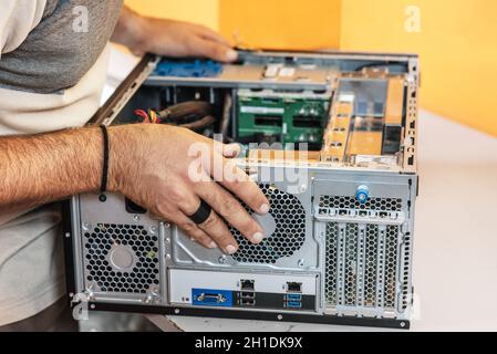 Technician repairing the computer. Concept of computer hardware, repairing, upgrade and technology . Stock Photo
