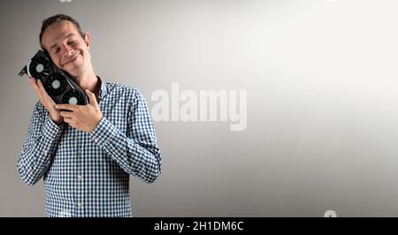 A man holding a video card  Stock Photo
