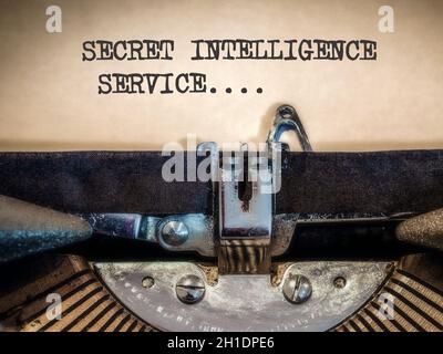 Secret Intelligence Service, displayed on a classic, vintage mechanical typewriter, typed on a cream coloured piece of paper with dark vignette Stock Photo